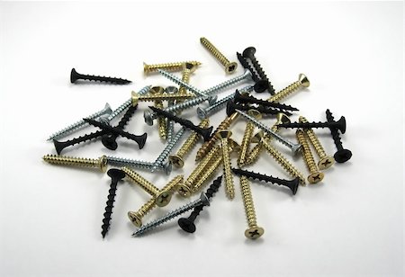Some laying black, silver and gold screws Stock Photo - Budget Royalty-Free & Subscription, Code: 400-05010972