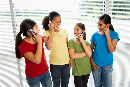 simsearch:400-05012508,k - Preteen girls of mutiple ethnicities talking on cell phones. Foto de stock - Super Valor sin royalties y Suscripción, Código: 400-05012481