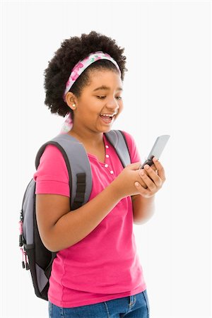 simsearch:400-05012508,k - African American girl with backpack text messaging on cell phone. Foto de stock - Super Valor sin royalties y Suscripción, Código: 400-05012509