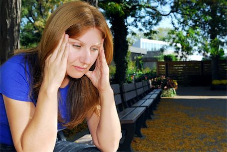 simsearch:400-04283915,k - Mature woman with a headache sitting on the park bench Stock Photo - Budget Royalty-Free & Subscription, Code: 400-05012643