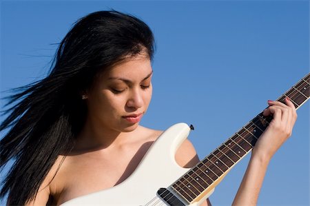 Nude Girl playing music on a guitar Stock Photo - Budget Royalty-Free & Subscription, Code: 400-05013253