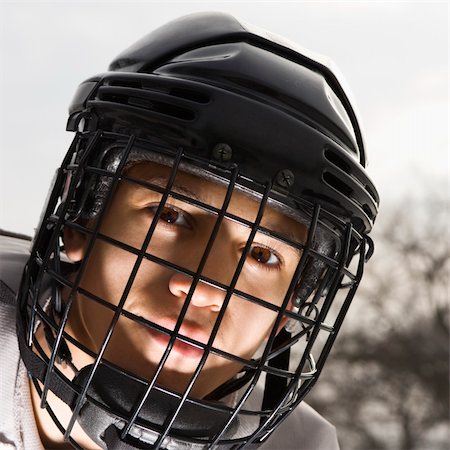 Boy in ice hockey uniform making eye contact. Stock Photo - Budget Royalty-Free & Subscription, Code: 400-05013490