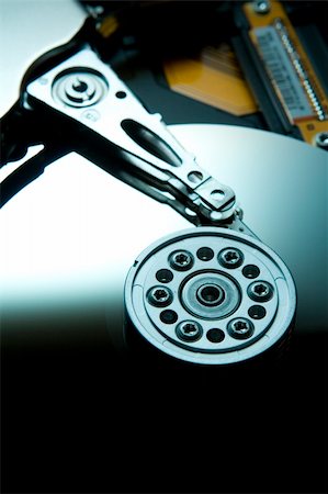 simsearch:400-05238336,k - Teal lit hard drive platter half highlight bottom Stock Photo - Budget Royalty-Free & Subscription, Code: 400-05024608