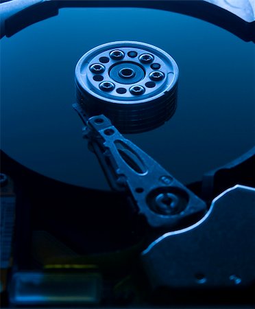simsearch:400-05238336,k - Blue lit hard drive platter dark top Stock Photo - Budget Royalty-Free & Subscription, Code: 400-05024958