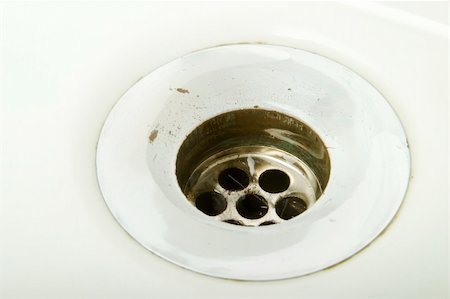 A drain on a retro porcelain sink. Foto de stock - Super Valor sin royalties y Suscripción, Código: 400-05025711