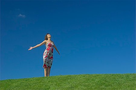 simsearch:400-03934248,k - Happy woman having fun on a beautiful green meadow Stock Photo - Budget Royalty-Free & Subscription, Code: 400-05025849