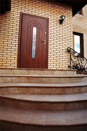 pictures of front porch gates - Input in a cottage with a staircase Stock Photo - Budget Royalty-Free & Subscription, Code: 400-05027274