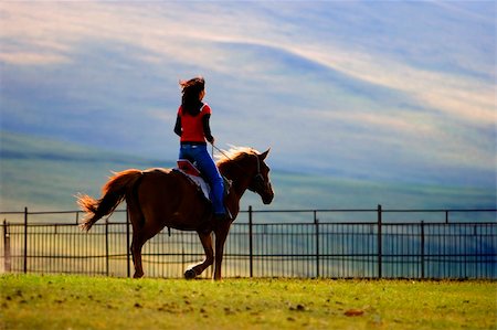 An Asian girl riding a horse returning home. Stock Photo - Budget Royalty-Free & Subscription, Code: 400-05020973