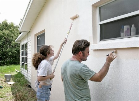 A father and daughter painting their house together. Stock Photo - Budget Royalty-Free & Subscription, Code: 400-05021226