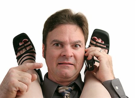 foot rings images - A man having an office romance, caught in the act when the phone rings. Stock Photo - Budget Royalty-Free & Subscription, Code: 400-05021847