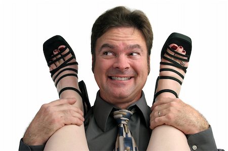 foot rings images - A man at the office party smiling because he is having a fling with a co-worker. Stock Photo - Budget Royalty-Free & Subscription, Code: 400-05021870