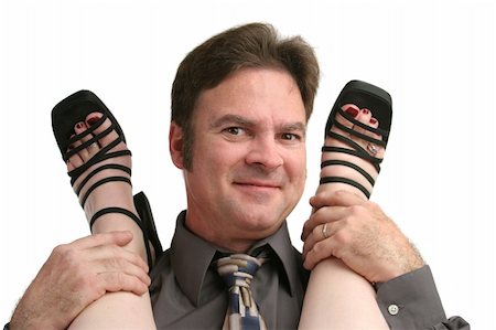 foot rings images - A smiling man in business clothes with a woman's feet on his shoulders. Stock Photo - Budget Royalty-Free & Subscription, Code: 400-05021903