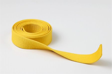 Yellow karate belt, wound, isolated Stock Photo - Budget Royalty-Free & Subscription, Code: 400-05022800