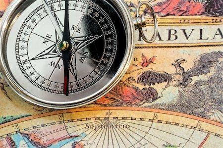 Silver metal compass on the old map Stock Photo - Budget Royalty-Free & Subscription, Code: 400-05022987