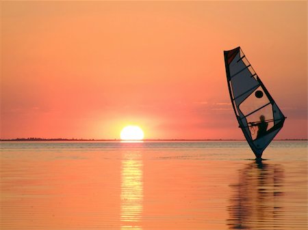 simsearch:400-03992760,k - Silhouette of a windsurfer on waves of a gulf on a sunset 3 Stock Photo - Budget Royalty-Free & Subscription, Code: 400-05023877