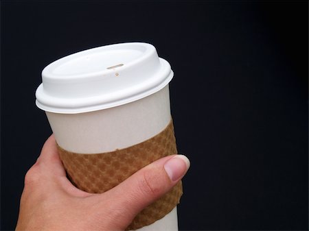 simsearch:400-05336522,k - a female's hand holding a disposable paper coffee cup Stock Photo - Budget Royalty-Free & Subscription, Code: 400-05034082