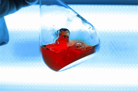 simsearch:400-09011632,k - chemical retort with red liquid, white and blue background Stock Photo - Budget Royalty-Free & Subscription, Code: 400-05035379