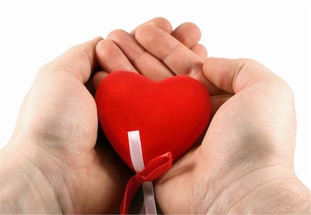 Men's hands holding a red heart in palms Stock Photo - Budget Royalty-Free & Subscription, Code: 400-05035712