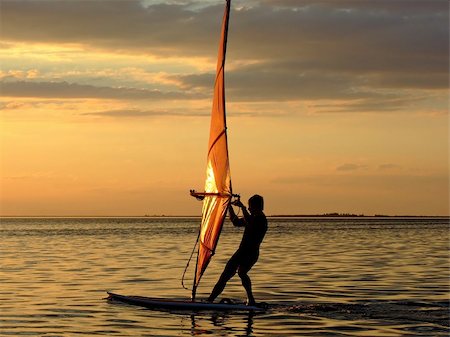 simsearch:400-03992760,k - Silhouette of a wind-surfer on waves of a gulf on a sunset 2 Stock Photo - Budget Royalty-Free & Subscription, Code: 400-05036407