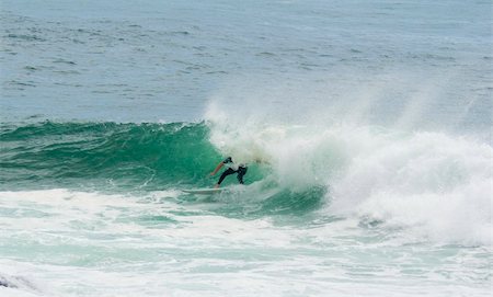 pipeline with man photos - a surfer surfing out of a big wave about to dump him Stock Photo - Budget Royalty-Free & Subscription, Code: 400-05037985