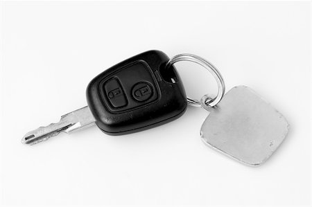 sweet car - pilot with car keys over white background Stock Photo - Budget Royalty-Free & Subscription, Code: 400-05038039