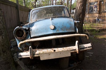 An old remains of a car found in a yard in a countryside. Stock Photo - Budget Royalty-Free & Subscription, Code: 400-05038603