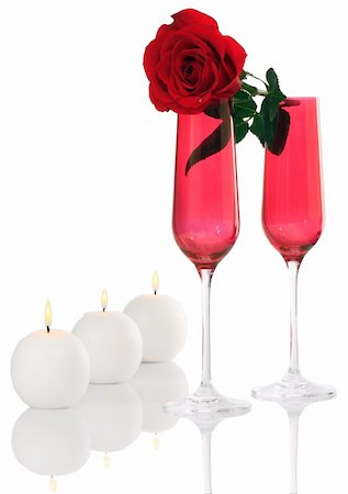 simsearch:400-07166551,k - Isolated; Romantic Red Champagne Flutes with Fresh Red Rose and White Candles Stock Photo - Budget Royalty-Free & Subscription, Code: 400-05031325