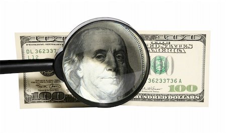 Magnifying glass and banknote of 100 dollars isolated on white background Stock Photo - Budget Royalty-Free & Subscription, Code: 400-05033279