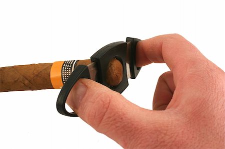 simsearch:400-05207678,k - A Hand cutting a cigar on white background Stock Photo - Budget Royalty-Free & Subscription, Code: 400-05045456