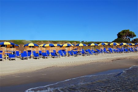 simsearch:400-07553490,k - Beautiful empty beach wit umbrellas, sea and a blue sky Stock Photo - Budget Royalty-Free & Subscription, Code: 400-05048979