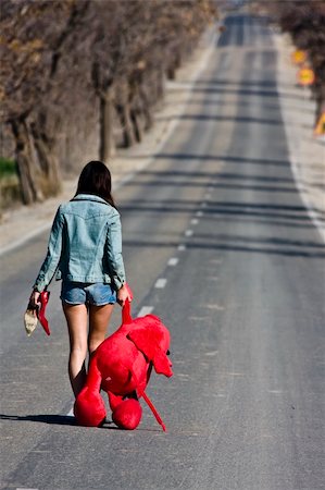 running away scared - Young woman left behind with her teddy bear. Stock Photo - Budget Royalty-Free & Subscription, Code: 400-05040024