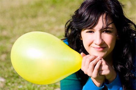 Cute girl with yellow colored balloon in the park Stock Photo - Budget Royalty-Free & Subscription, Code: 400-05040021