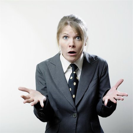 Attractive young woman in a business suit, gesturing with a look of frustration on her face Stock Photo - Budget Royalty-Free & Subscription, Code: 400-05040510