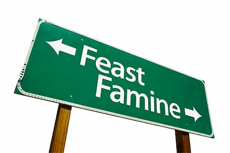 simsearch:400-05730469,k - Feast or Famine road sign isolated on a white background. Contains Clipping Path. Stock Photo - Budget Royalty-Free & Subscription, Code: 400-05040592