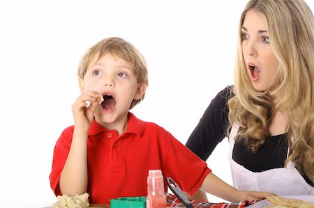 parent child messy cooking - Oh NO child tasting cookie batter Stock Photo - Budget Royalty-Free & Subscription, Code: 400-05040782