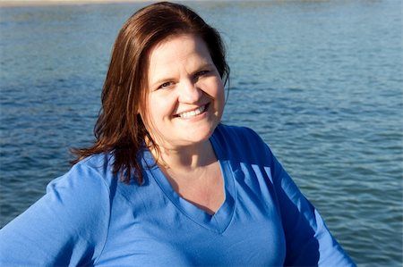 Beautiful plus-sized model posing by the water. Stock Photo - Budget Royalty-Free & Subscription, Code: 400-05043071