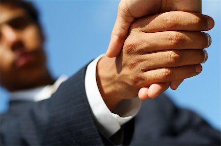 simsearch:400-04609965,k - Business man dressed in suit shaking hands with another person. Concept: Deal done or agreement made. Stock Photo - Budget Royalty-Free & Subscription, Code: 400-05043523