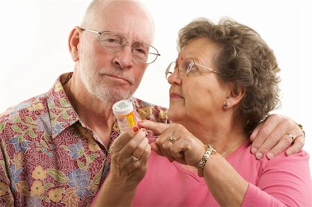 Senior Couple reads a prescription bottle. Stock Photo - Budget Royalty-Free & Subscription, Code: 400-05055327