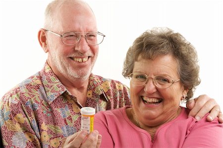 Senior Couple reads a prescription bottle. Stock Photo - Budget Royalty-Free & Subscription, Code: 400-05055328