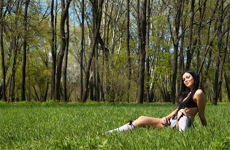 simsearch:400-03976636,k - sexy brunette getting spring sunbath, sitting on the green grass Stock Photo - Budget Royalty-Free & Subscription, Code: 400-05056288