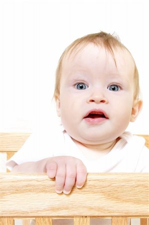 simsearch:400-05153083,k - Little Baby hanging onto crib side, closeup shot Stock Photo - Budget Royalty-Free & Subscription, Code: 400-05057897