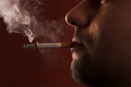 simsearch:400-05207678,k - close up of an smoking man Stock Photo - Budget Royalty-Free & Subscription, Code: 400-05058424