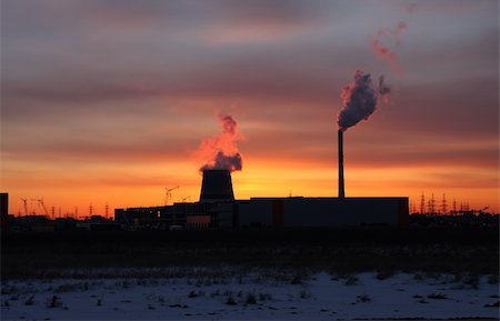 The landscape of industrial.Thermal power station in the rays of the setting sun. Romantic rays of the setting sun. Stock Photo - Budget Royalty-Free & Subscription, Code: 400-05051607