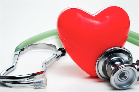 A red heart shape and a medical stethoscope. Stock Photo - Budget Royalty-Free & Subscription, Code: 400-05051876