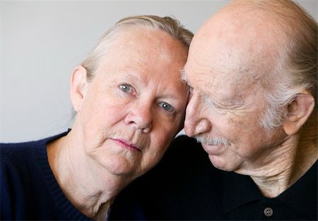 Close-up of senior couple focusing on worried woman Stock Photo - Budget Royalty-Free & Subscription, Code: 400-05053939