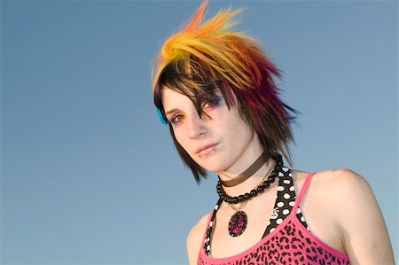 simsearch:400-04016564,k - Close-up of a young punk woman against a blue sky Stock Photo - Budget Royalty-Free & Subscription, Code: 400-05053951