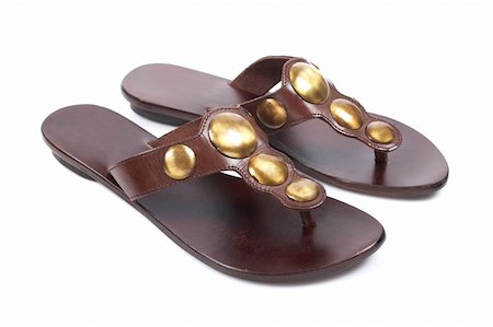 Lady sandals with soft shadow on white background. Shallow depth of field Stock Photo - Budget Royalty-Free & Subscription, Code: 400-05068659