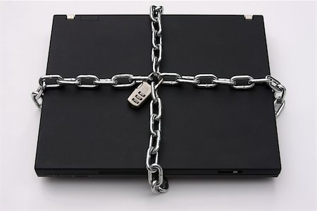 Laptop Computer secured with lock and chain Stock Photo - Budget Royalty-Free & Subscription, Code: 400-05068876