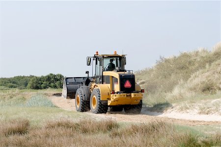 dune driving - Bulldozer driving fast throw the dunes Stock Photo - Budget Royalty-Free & Subscription, Code: 400-05069019