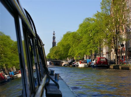 Picture of a big canal in Amsterdam, Holland. Picture taken from one of the touristy boats. Stock Photo - Budget Royalty-Free & Subscription, Code: 400-05069292